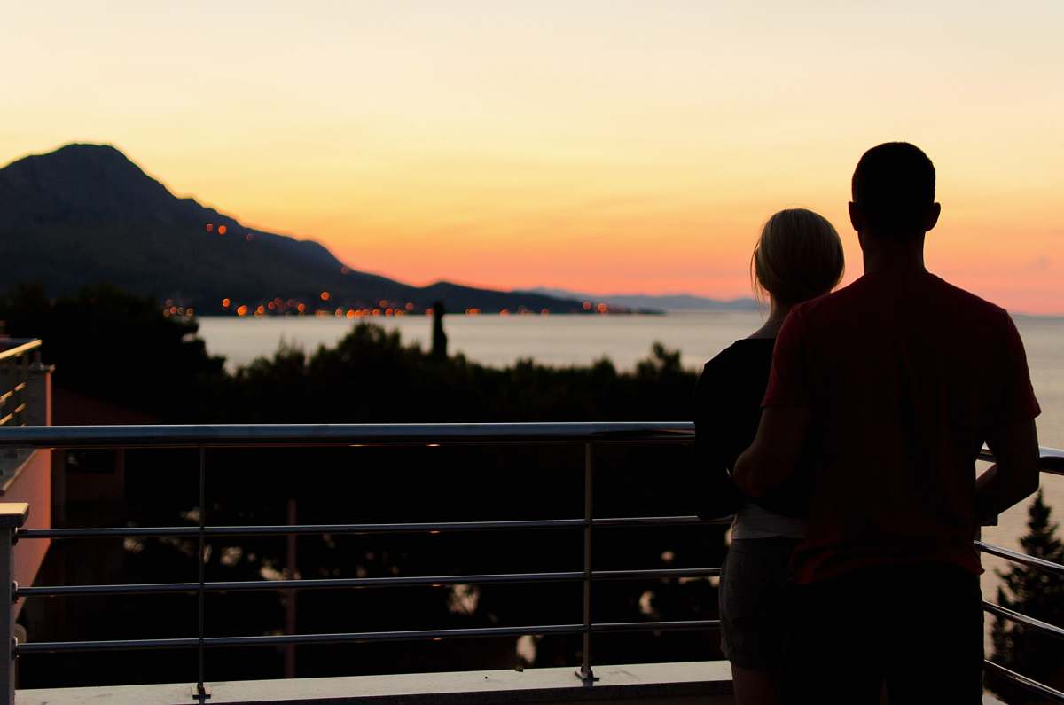human silhouette of couple on terrace view