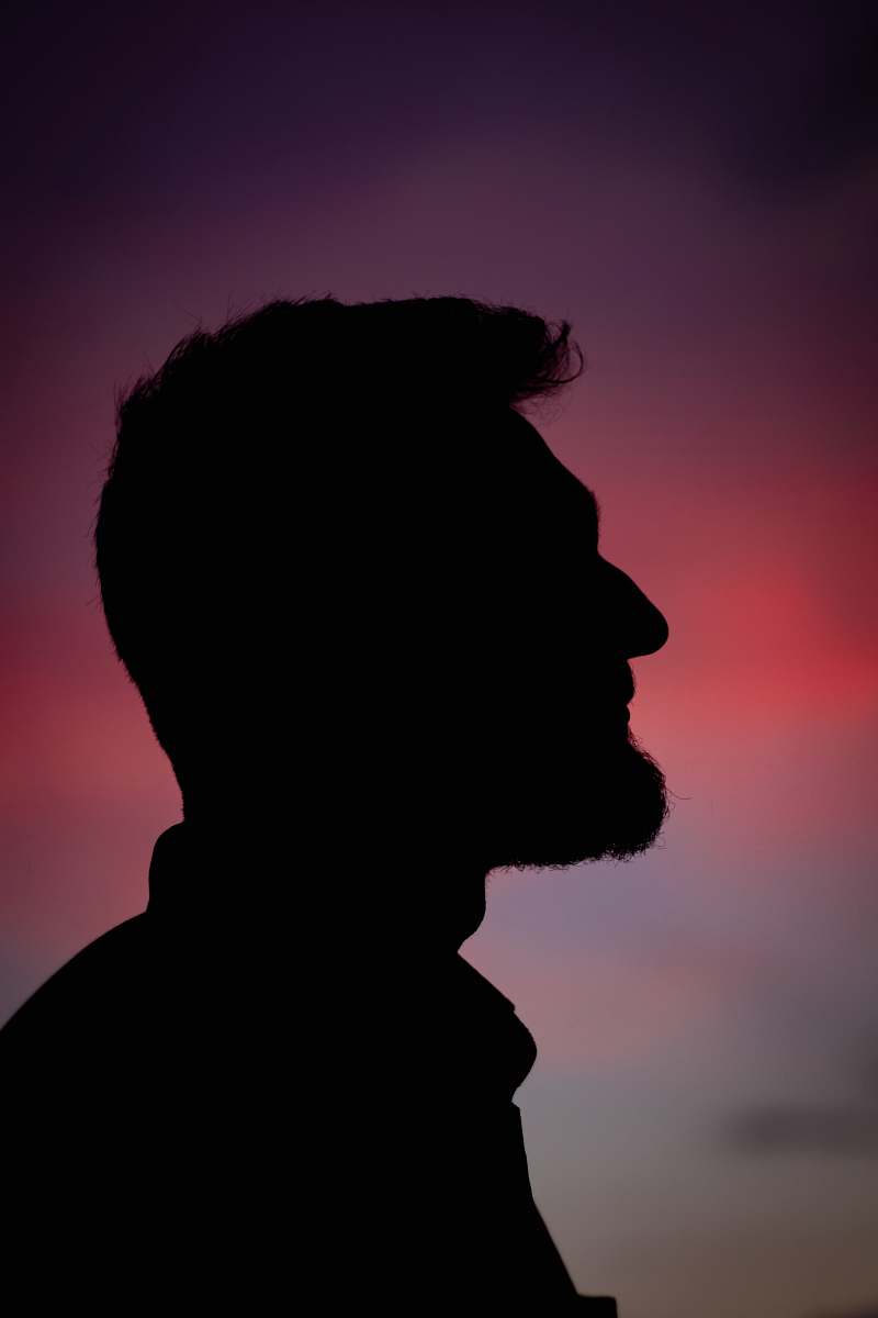 silhouette silhouette of man during dusk human