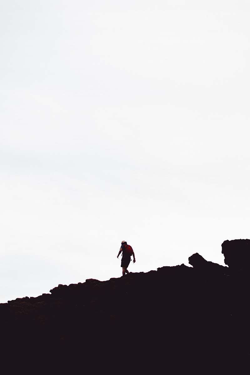 human silhouette of man on hill standing