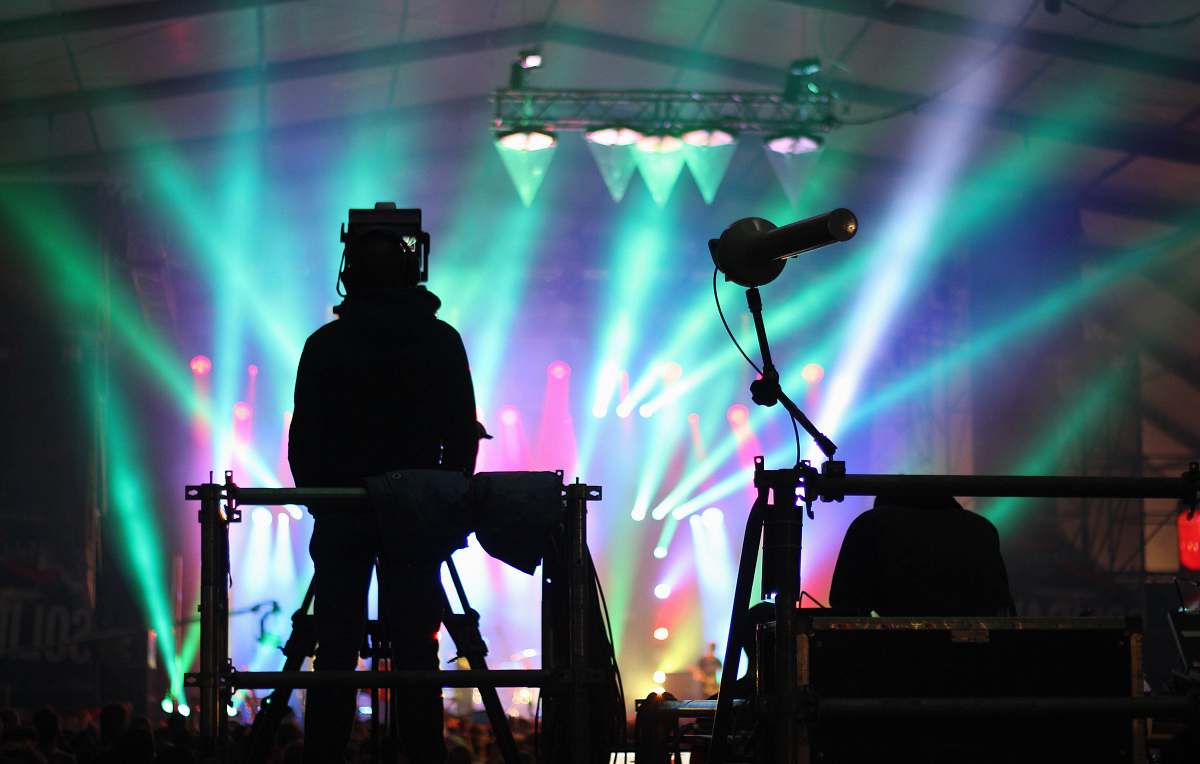 stage silhouette of man standing on stage concert