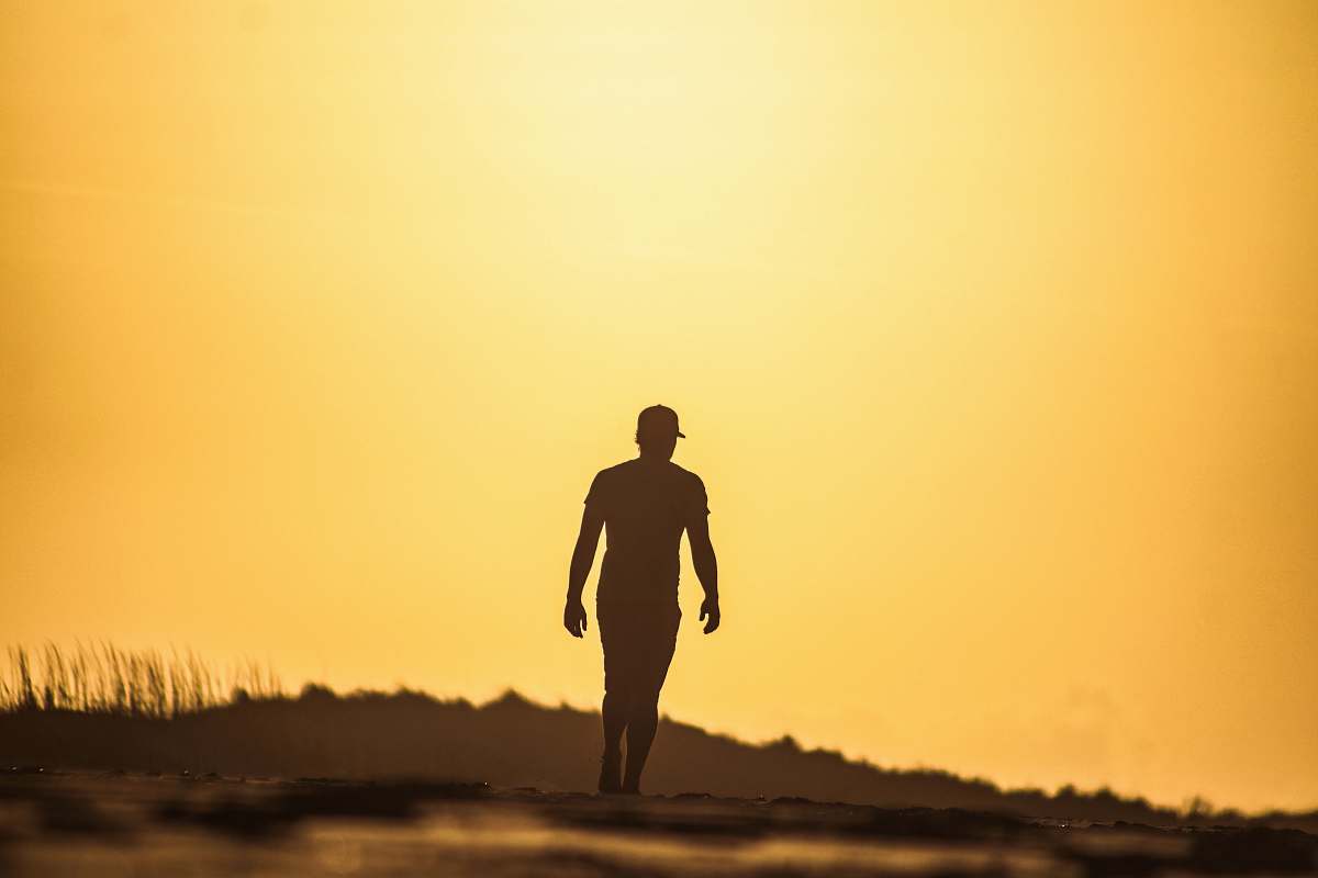 people silhouette of man walking human