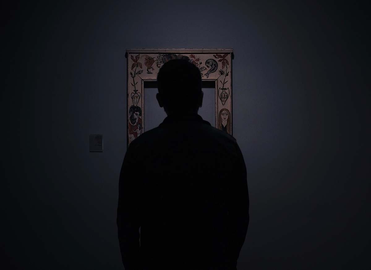 human silhouette of person facing an empty photo frame barcelona