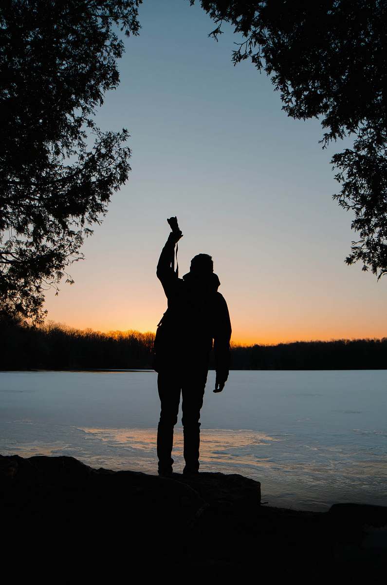 human silhouette of person raising his right hand people
