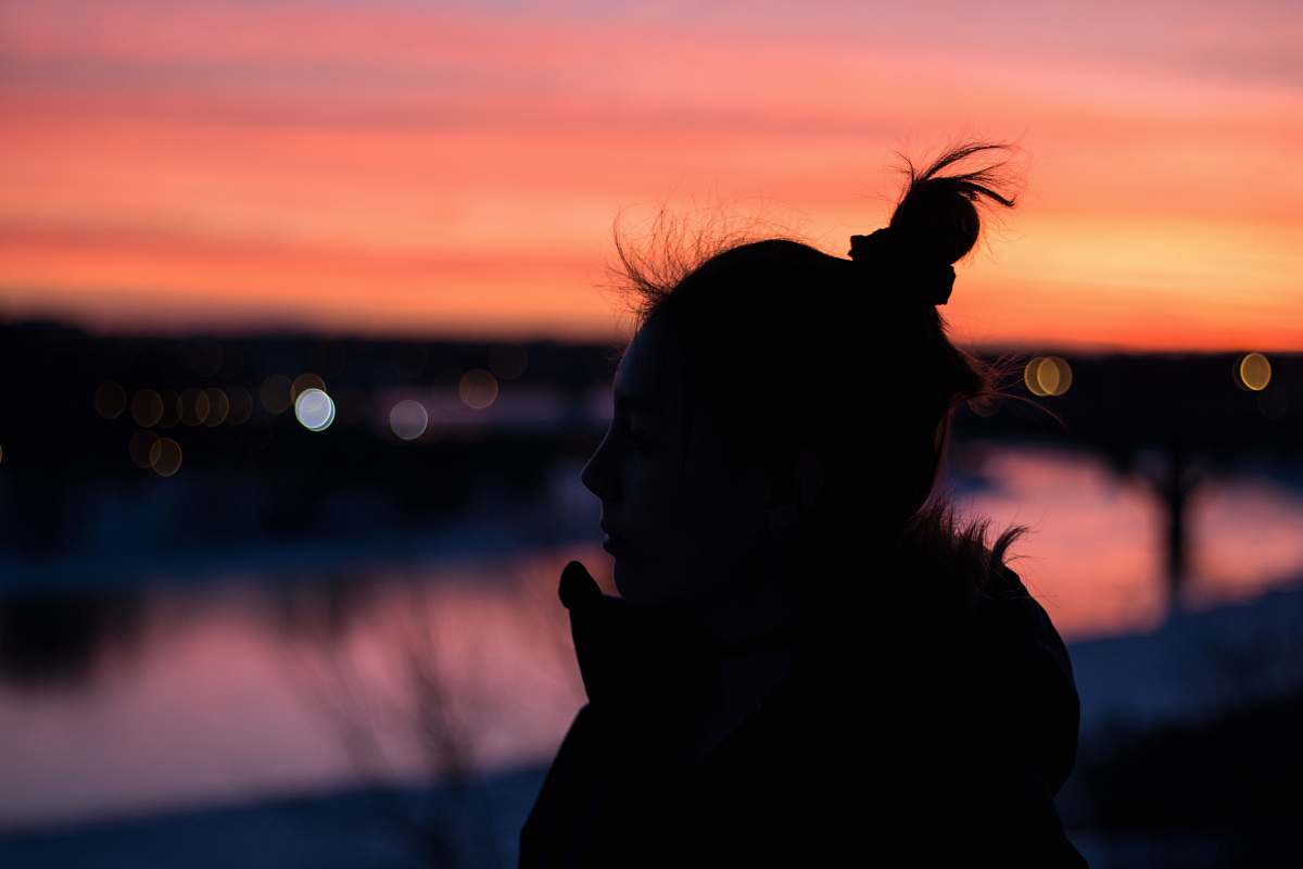 human silhouette of woman near bodies of water people
