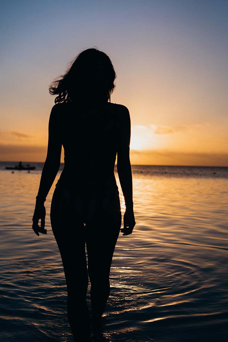 silhouette silhouette of woman standing n body of water water
