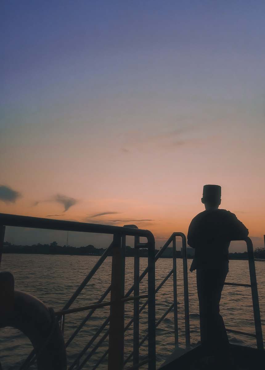 railing boy standing on the boat human