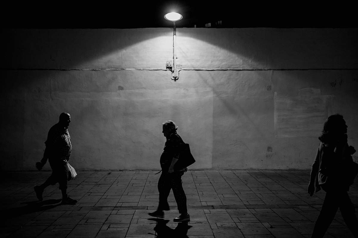 human grayscale photography unknown persons walking black-and-white