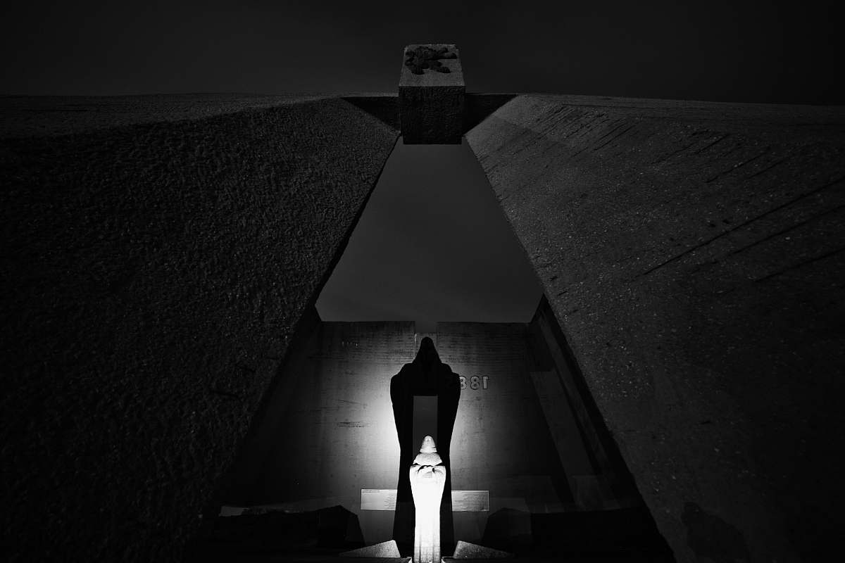 black-and-white low angle photography of building lighting