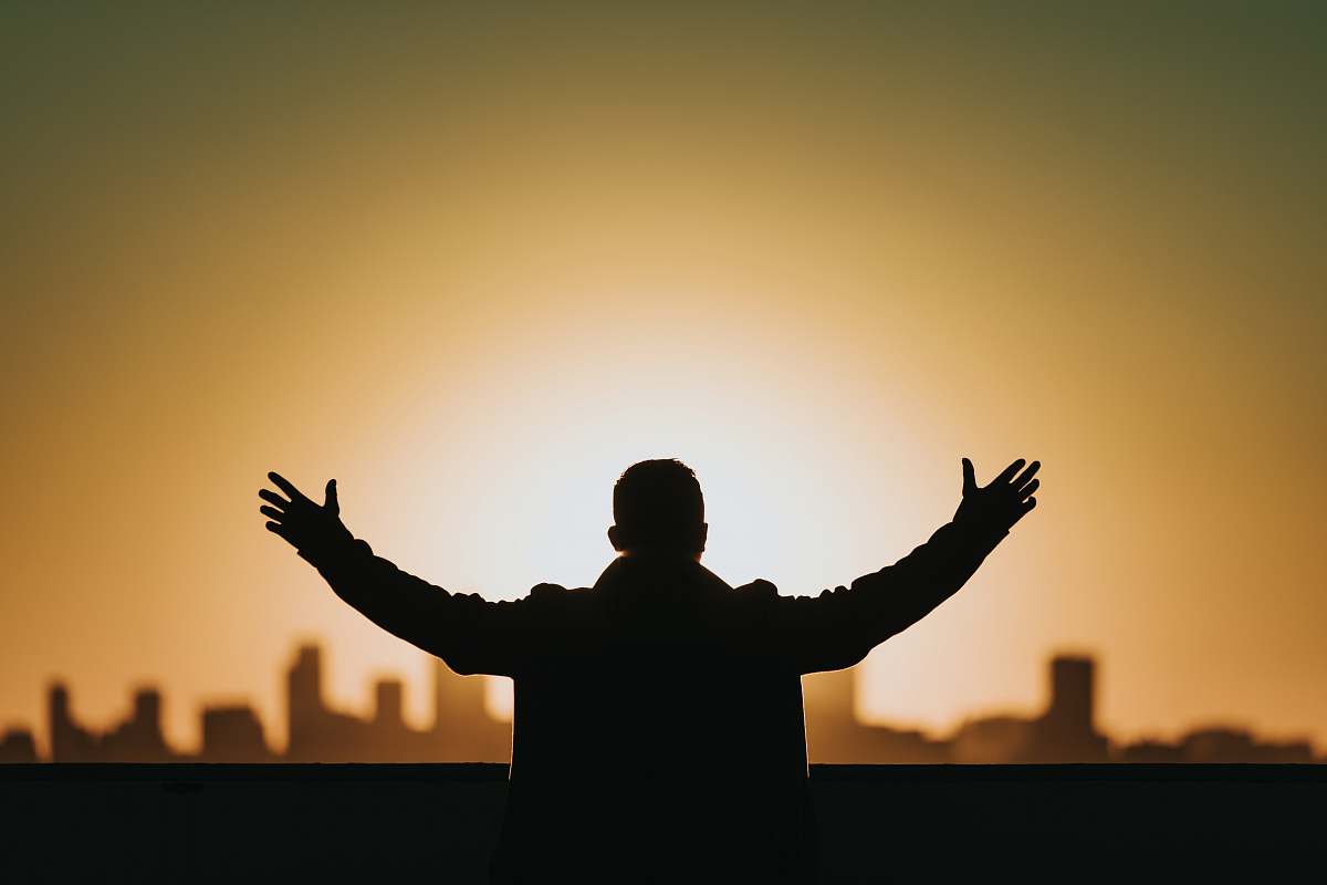 worship man raising both hands prayer