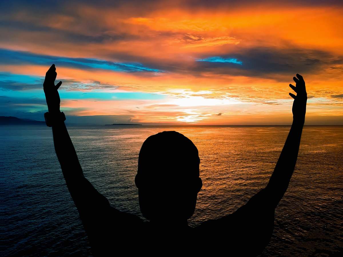 Capture the essence of adventure and tranquility with this stunning image of an outdoors man standing on the edge of a cliff. With arms outstretched against a breathtaking sunset, this scene embodies freedom, exploration, and the beauty of nature. Perfect for travel blogs, motivational content, or promotional materials for outdoor activities, this image evokes a sense of wonder and invites viewers to embrace the journey ahead.