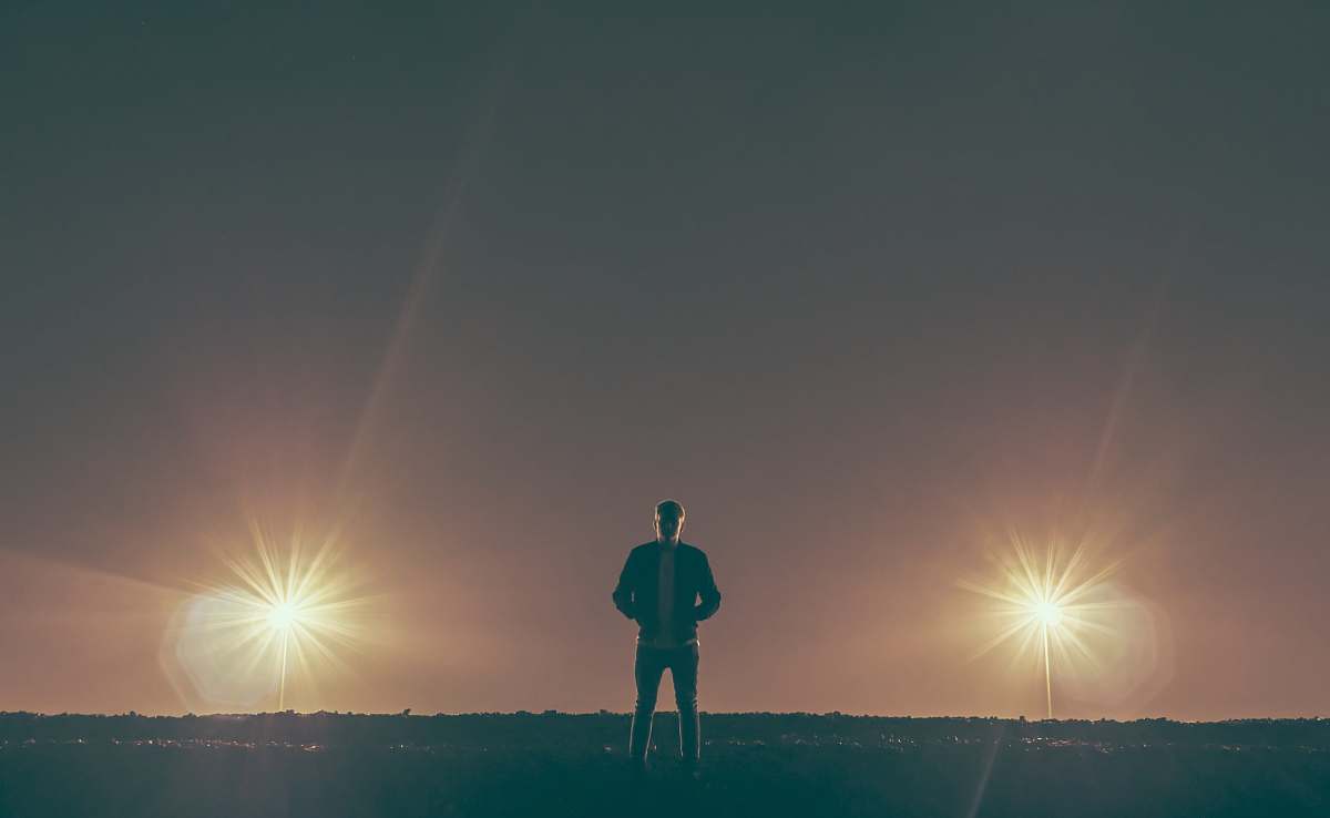 person man standing in the middle of nowhere man