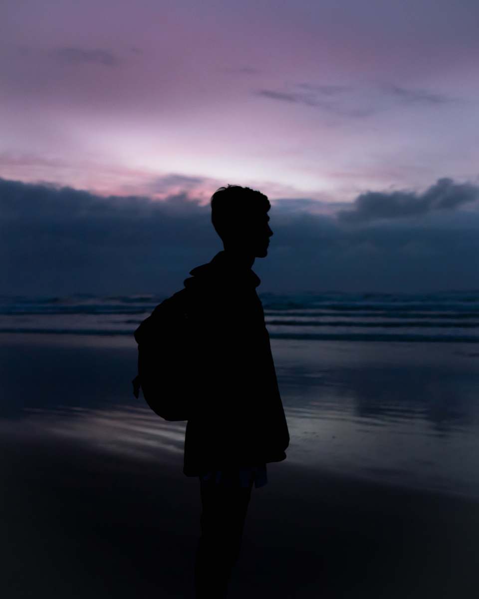 nature man wearing black backpack outdoors