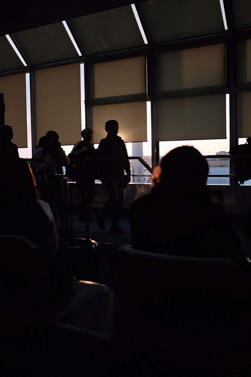 indoors people gathered by glass wall during daytime interior design