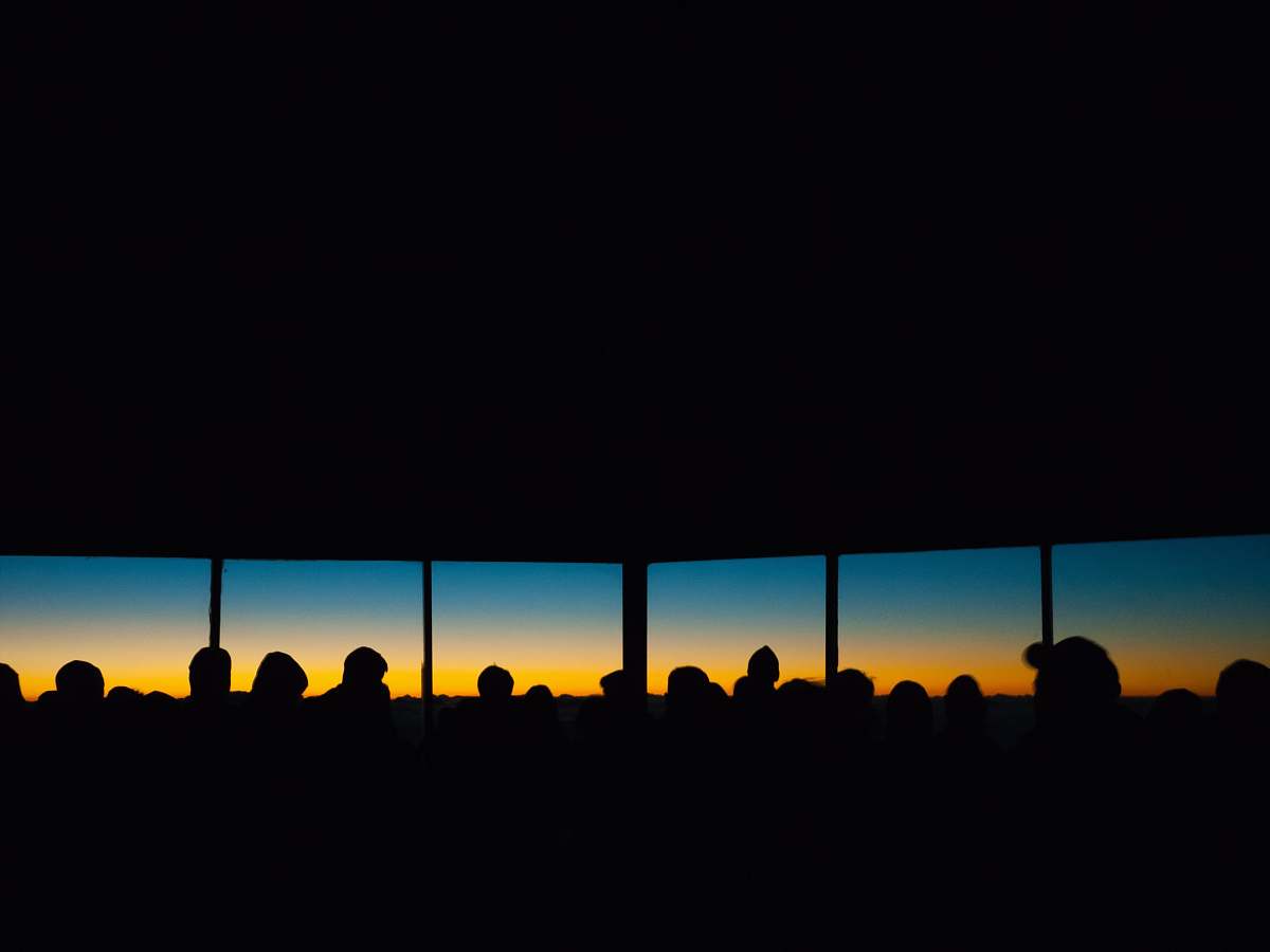 sunset people inside building sunrise