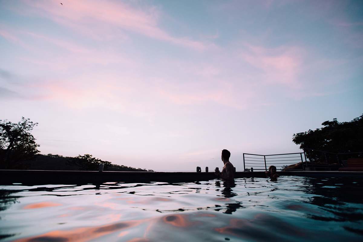nicaragua people swimming at pool under blue sky and white clouds during daytime water