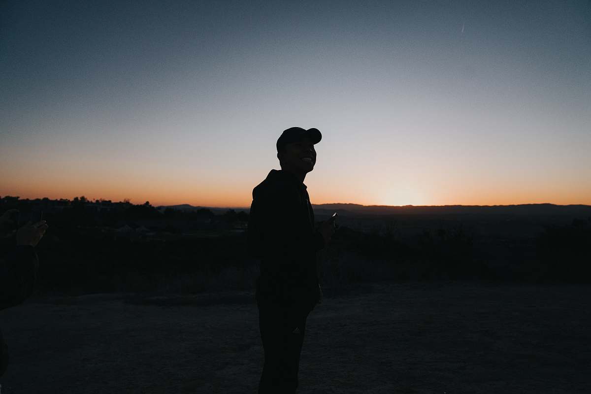 nature person standing at the field during day outdoors