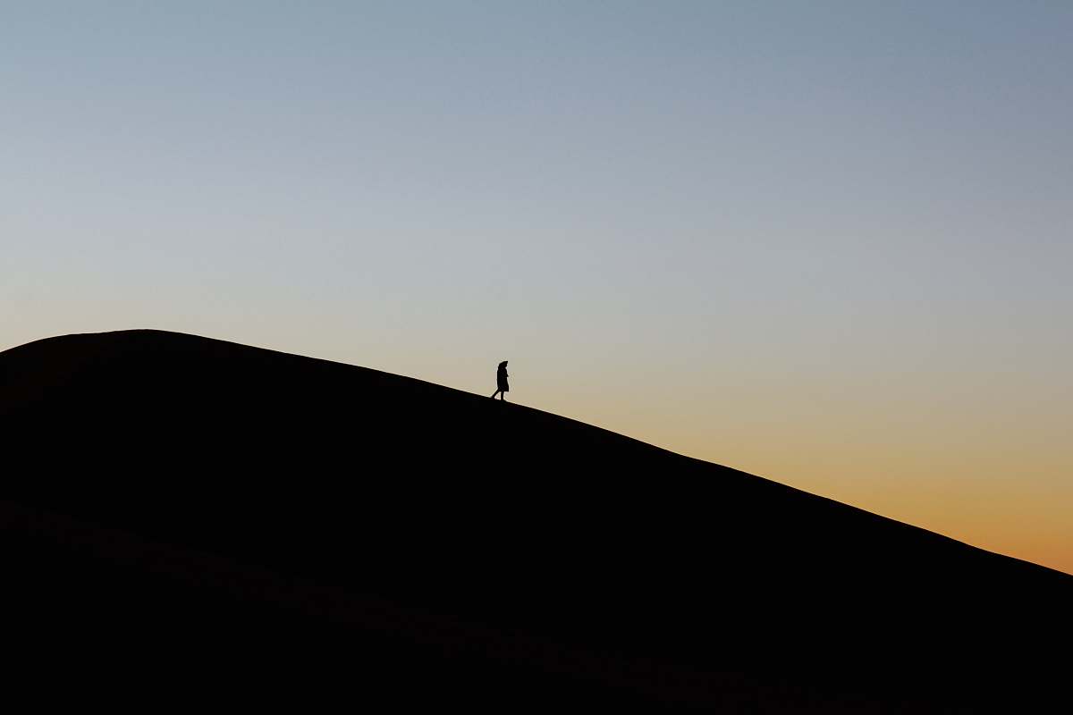 morocco person standing on cliff hill