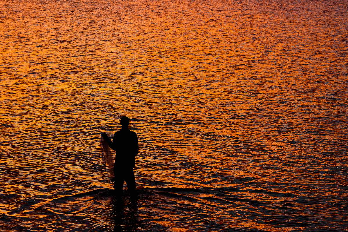 outdoors person standing on seashore water