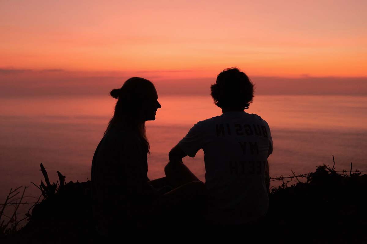 person silhouette of 2 person during golden hour human