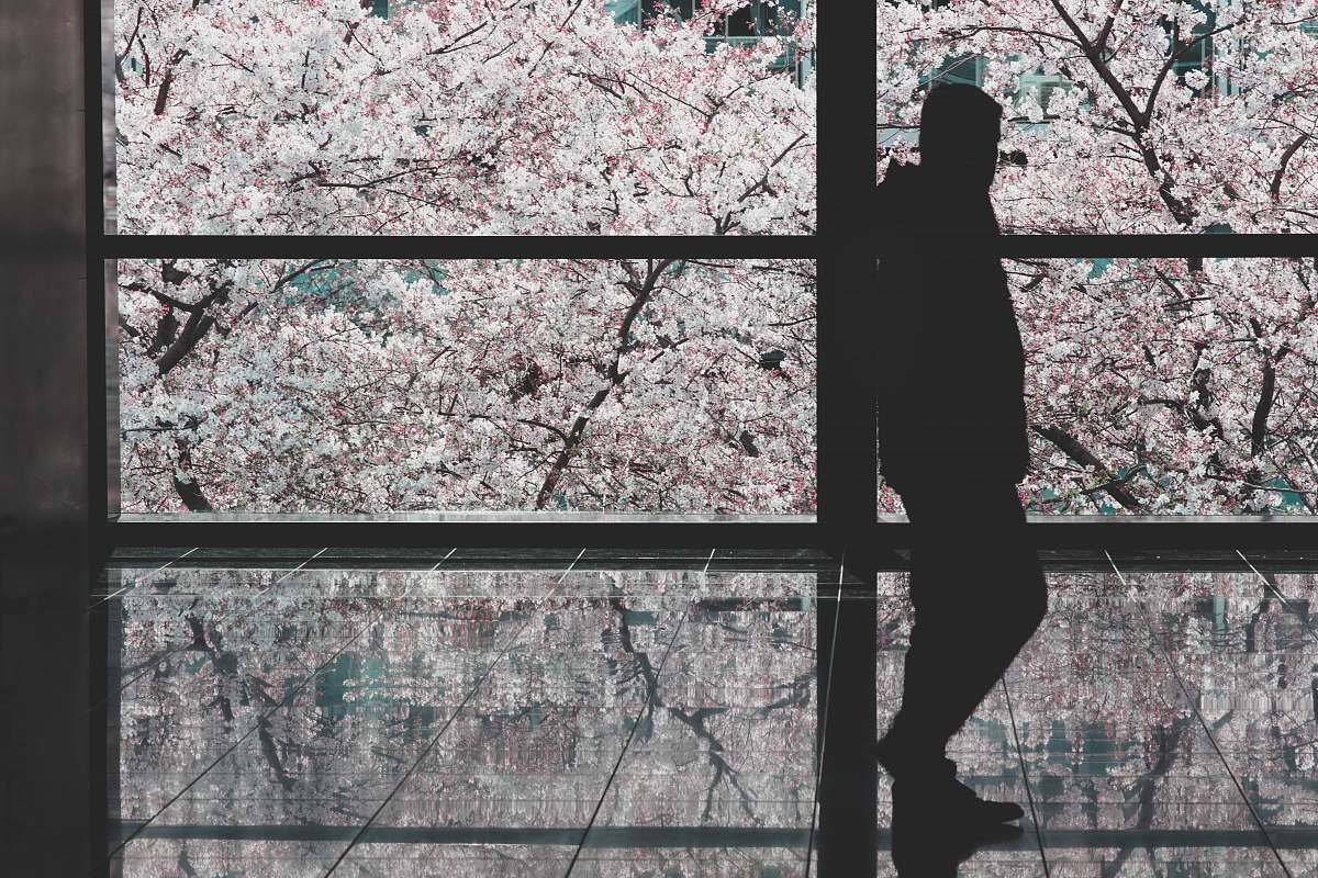 human silhouette of a man leaning on wall at daytime person