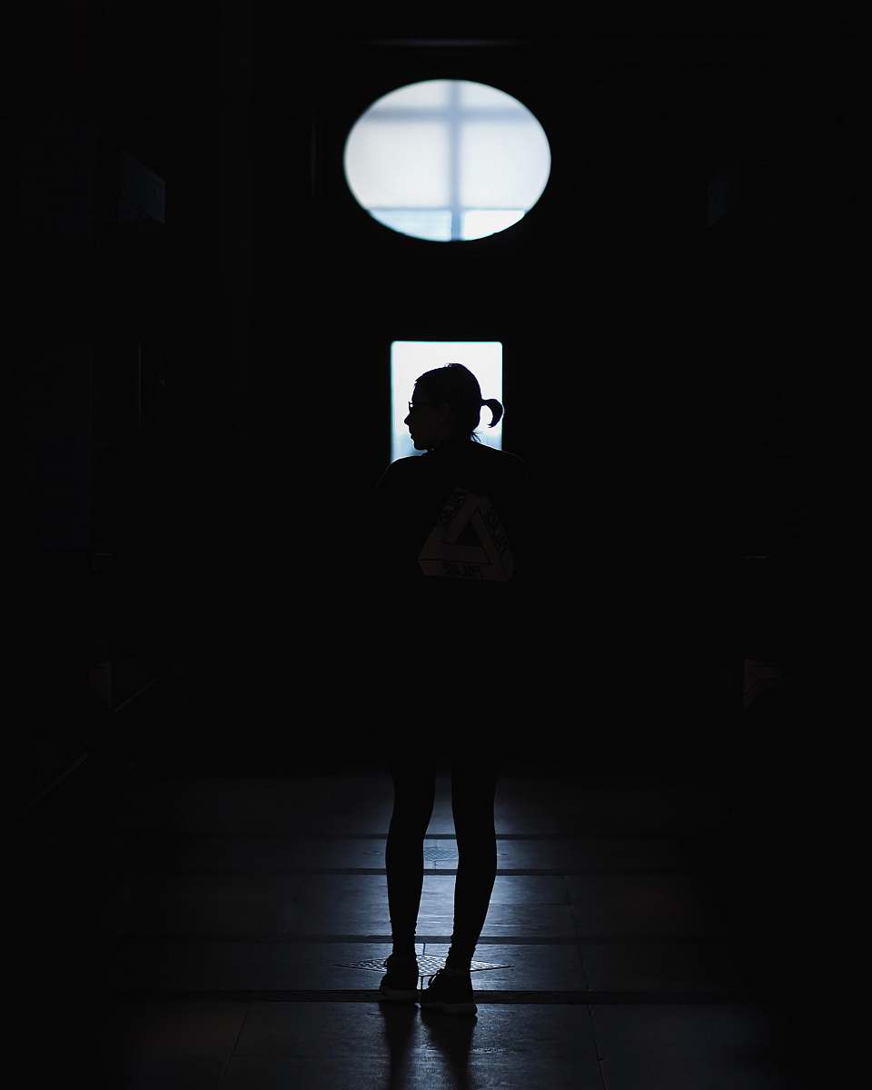 light silhouette of a standing person cambridge