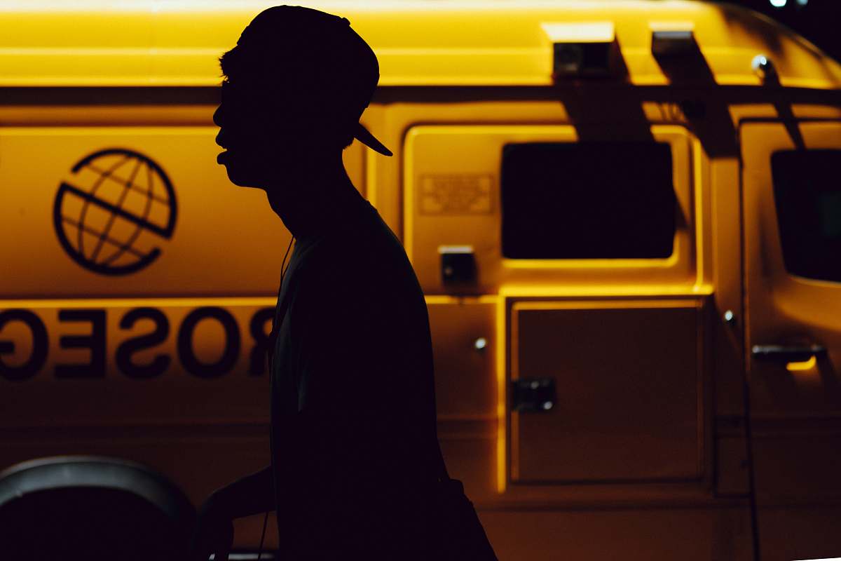 human silhouette of boy standing near vehicle person