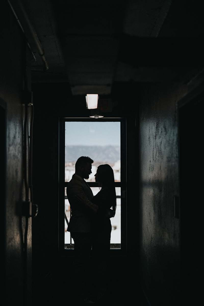 grey silhouette of couple inside dark room couple
