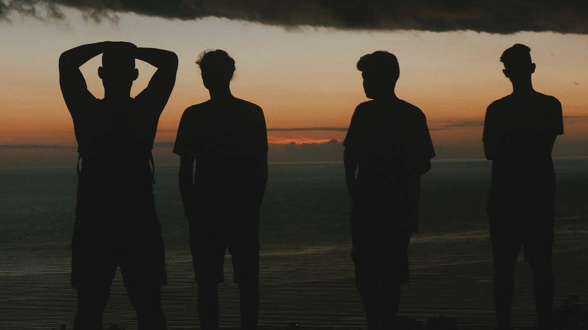 Human Silhouette Of Four Men At The Beach Person Image Free Photo