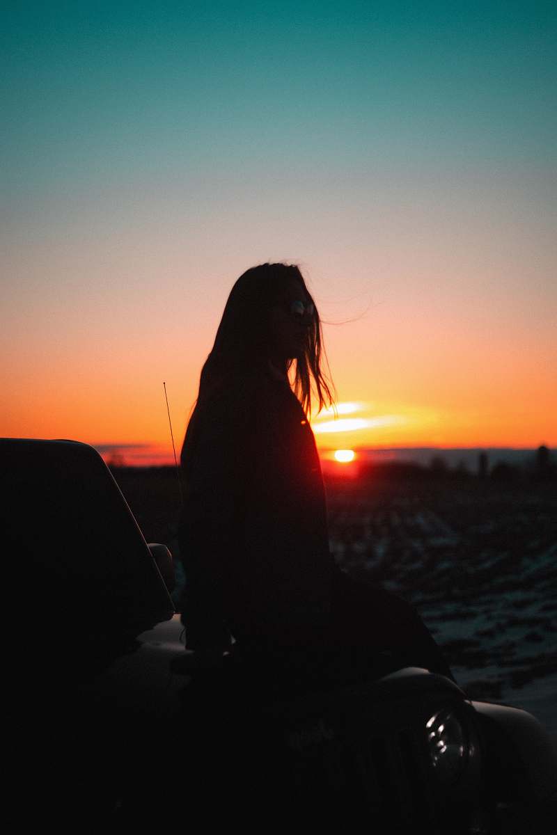 Nature Silhouette Of Girl Sitting During Golden Hour Outdoors Image ...