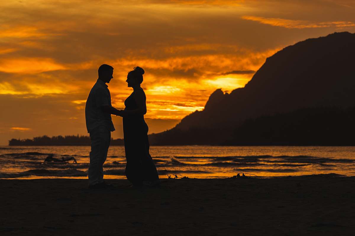 human silhouette of man and woman near ocean person