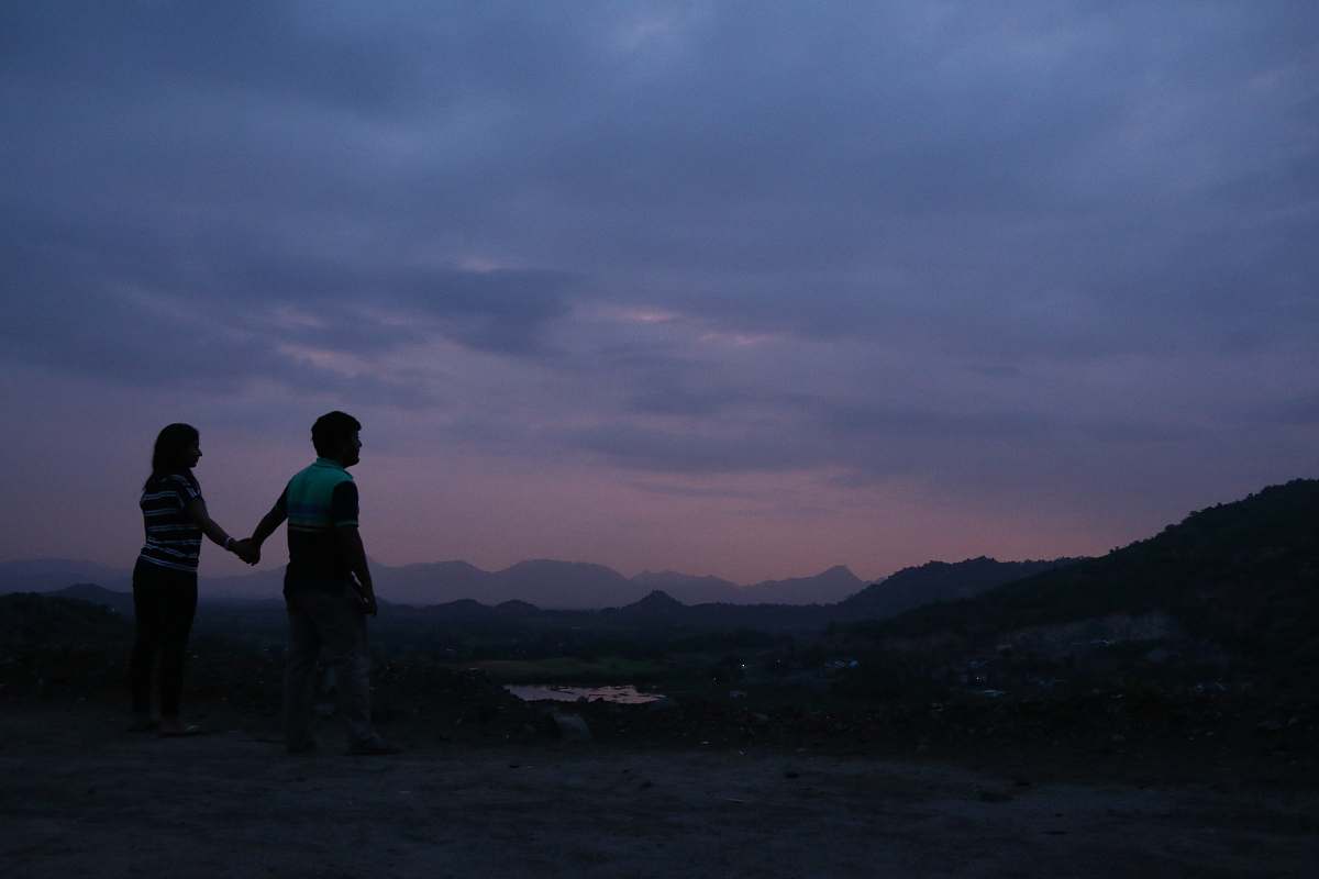 human silhouette of man and woman standing and holding hands person