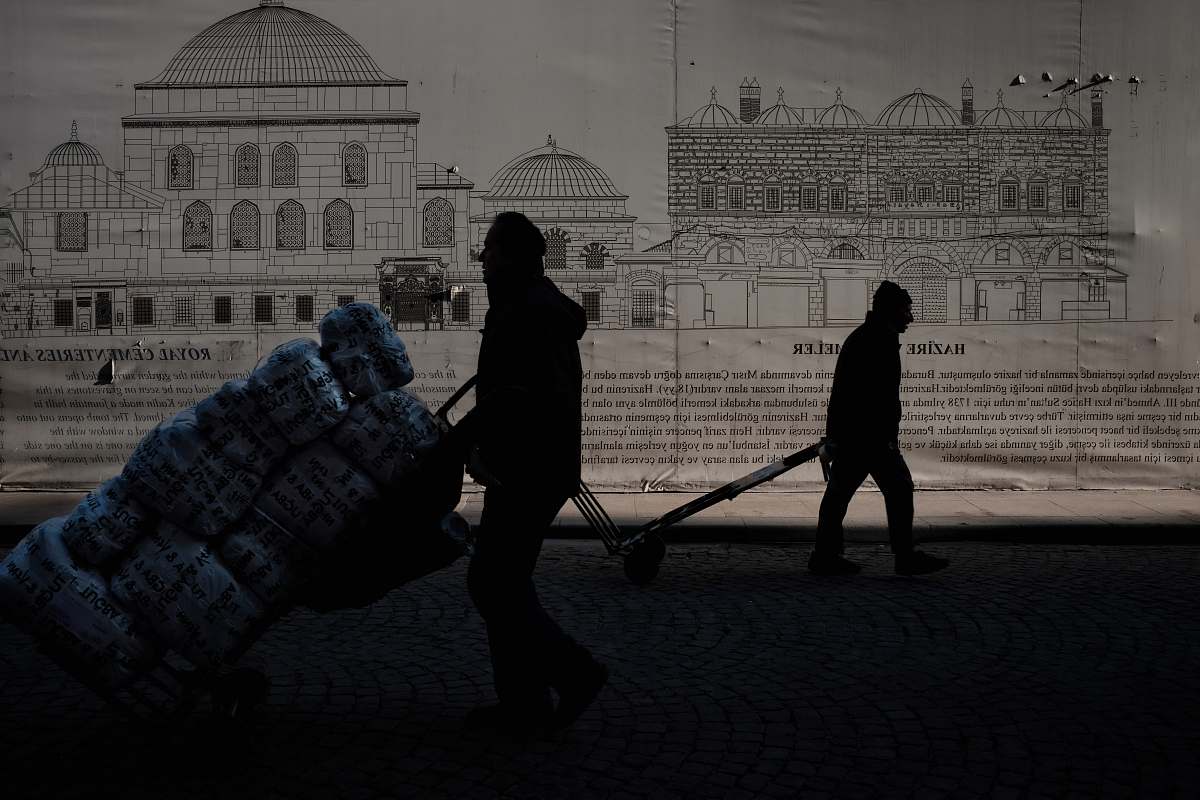 human silhouette of man and woman walking on street art