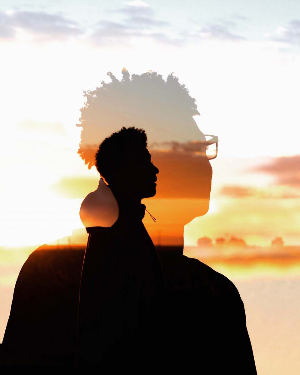 nature silhouette of man during golden hour sunset