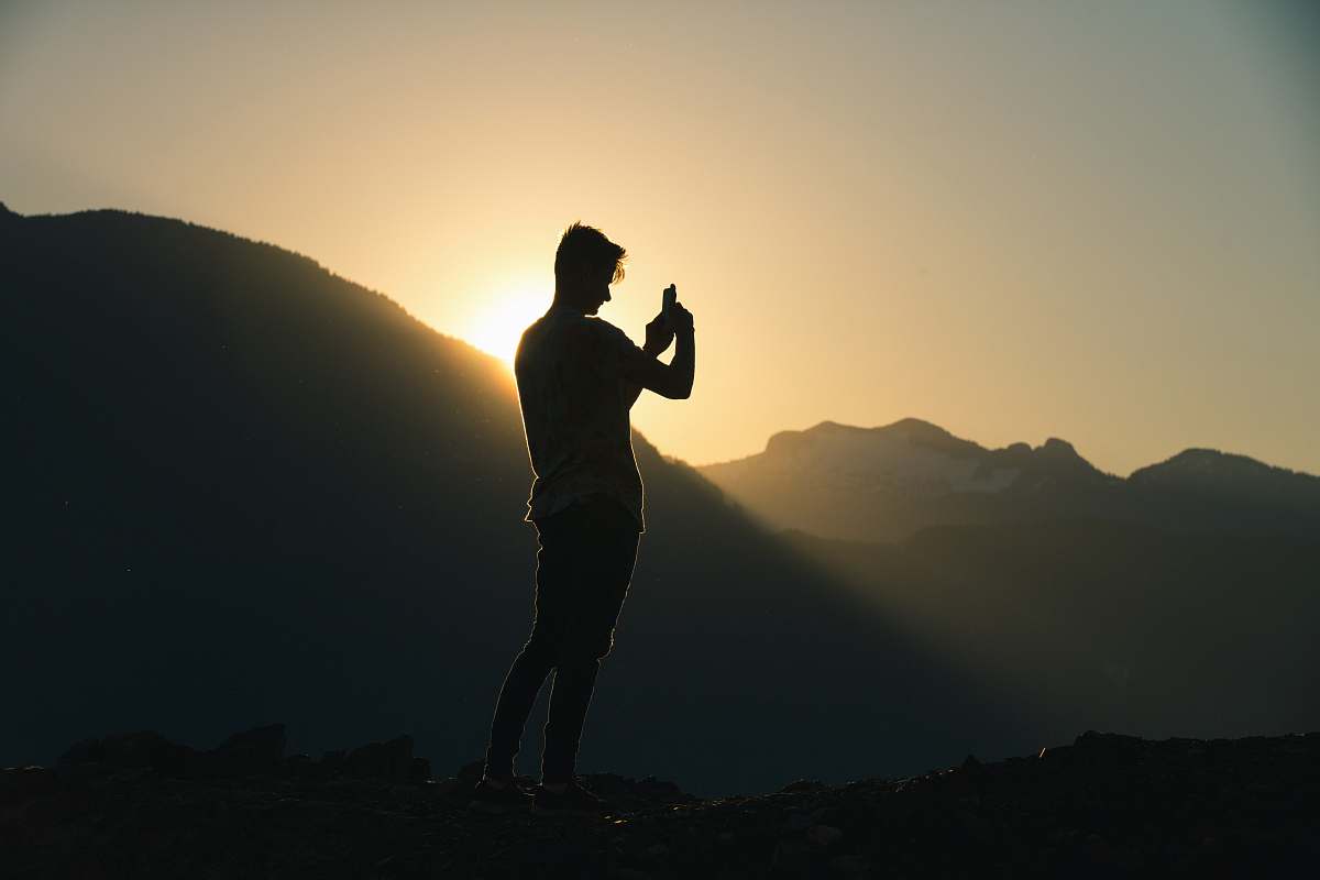 person silhouette of man during golden hour nature