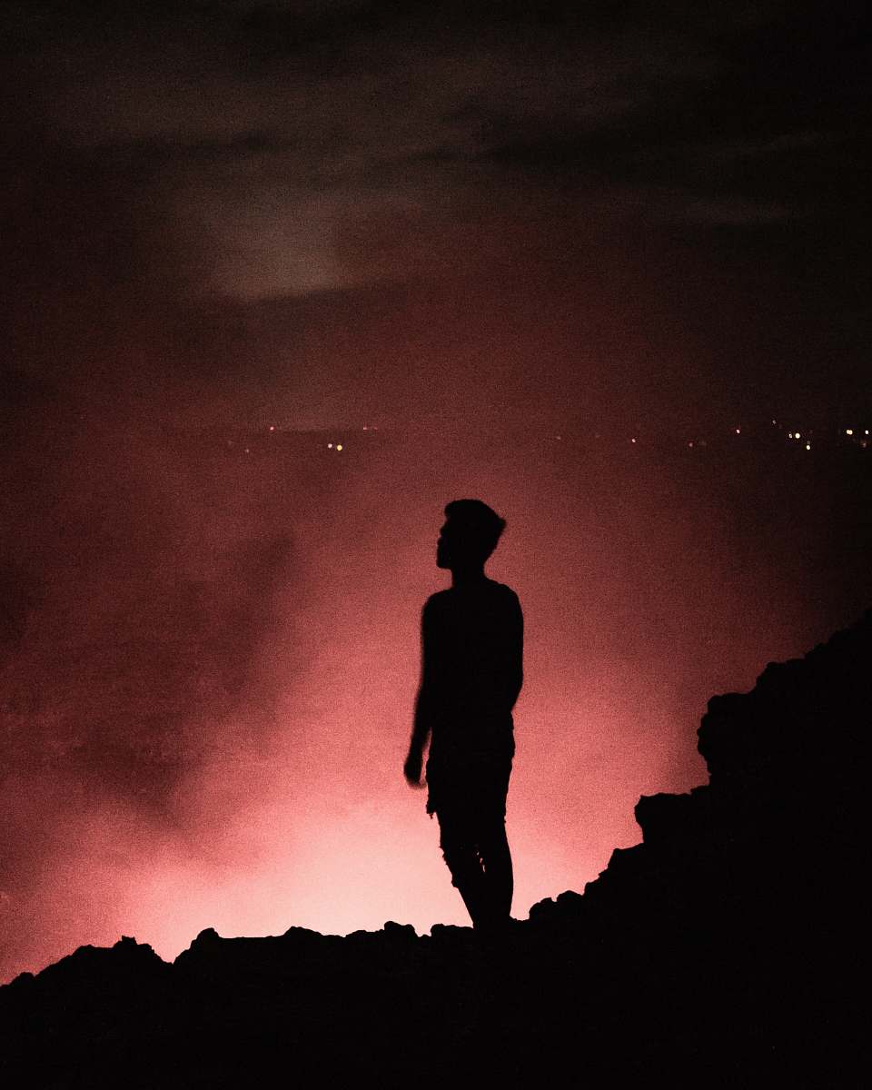 human silhouette of man during nighttime nature