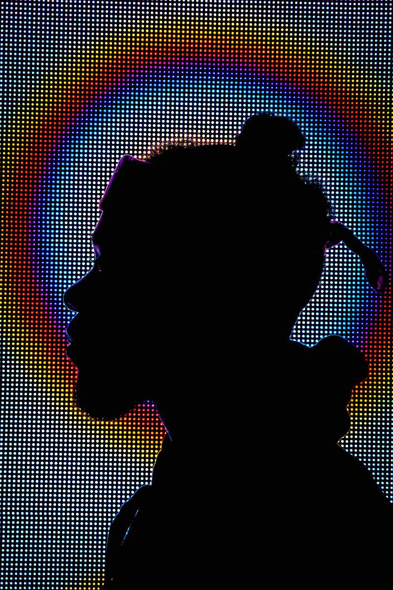 This captivating digital artwork showcases the colorful silhouette of a man facing right, set against a vivid backdrop featuring a rainbow-colored circle. Ideal for visual storytelling, this image can be utilized in various contexts such as personal development blogs, motivational content, or design projects that emphasize diversity and creativity. The striking combination of colors and shapes makes it a perfect choice for enhancing websites, social media graphics, and promotional materials.
