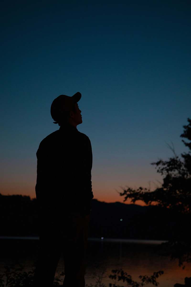 apparel silhouette of man looking at the sky clothing