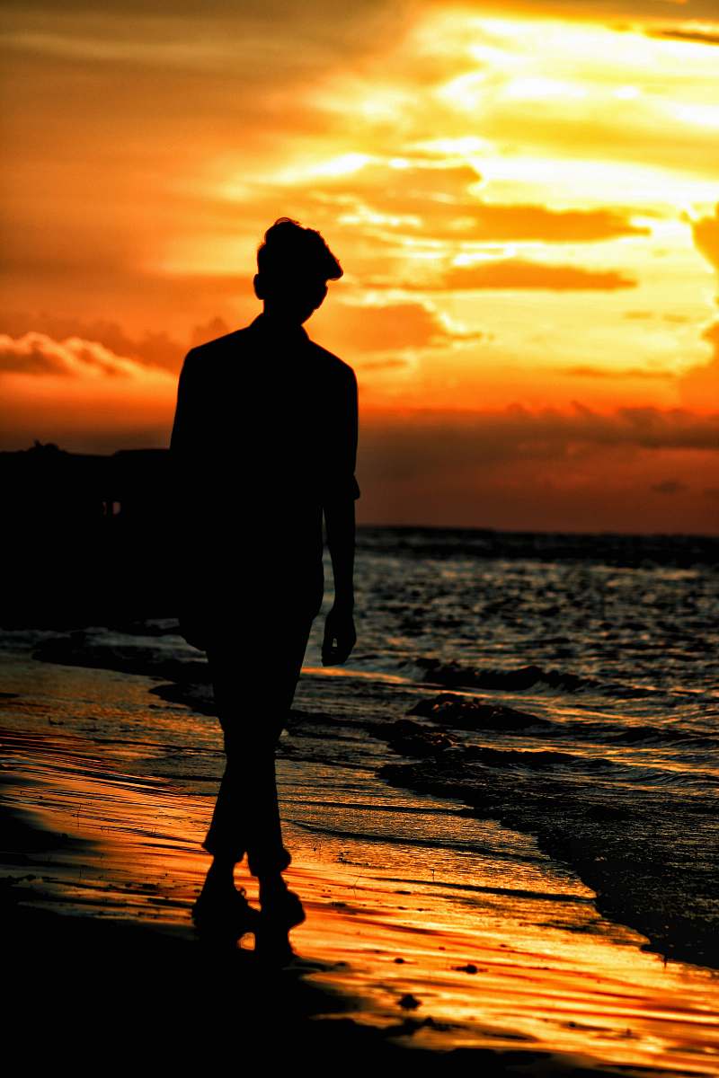 person silhouette of man on shore human