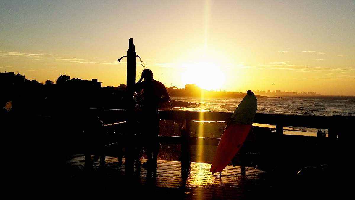 surfboard silhouette of man on terrace surfer