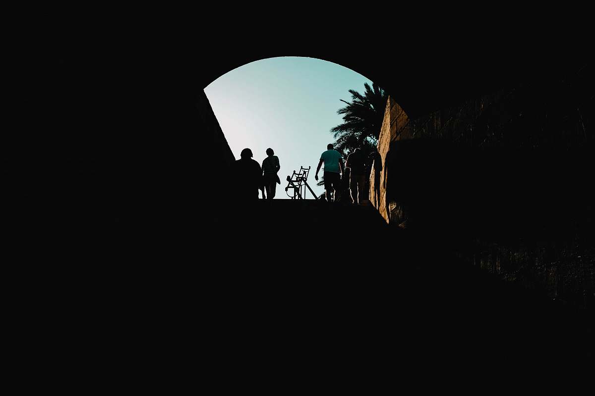 spain silhouette of man riding bicycle palma