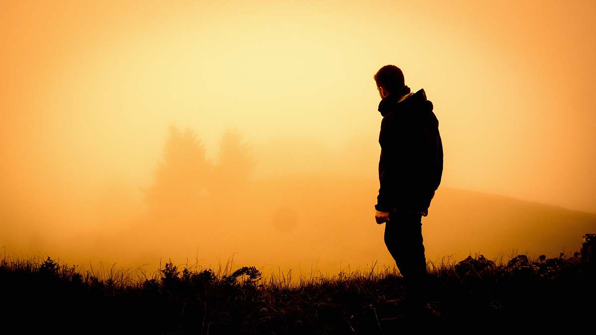human silhouette of man standing open field people