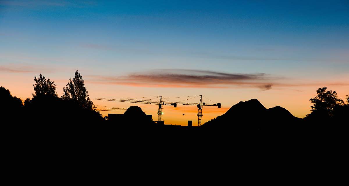 nature silhouette of mountain construction crane