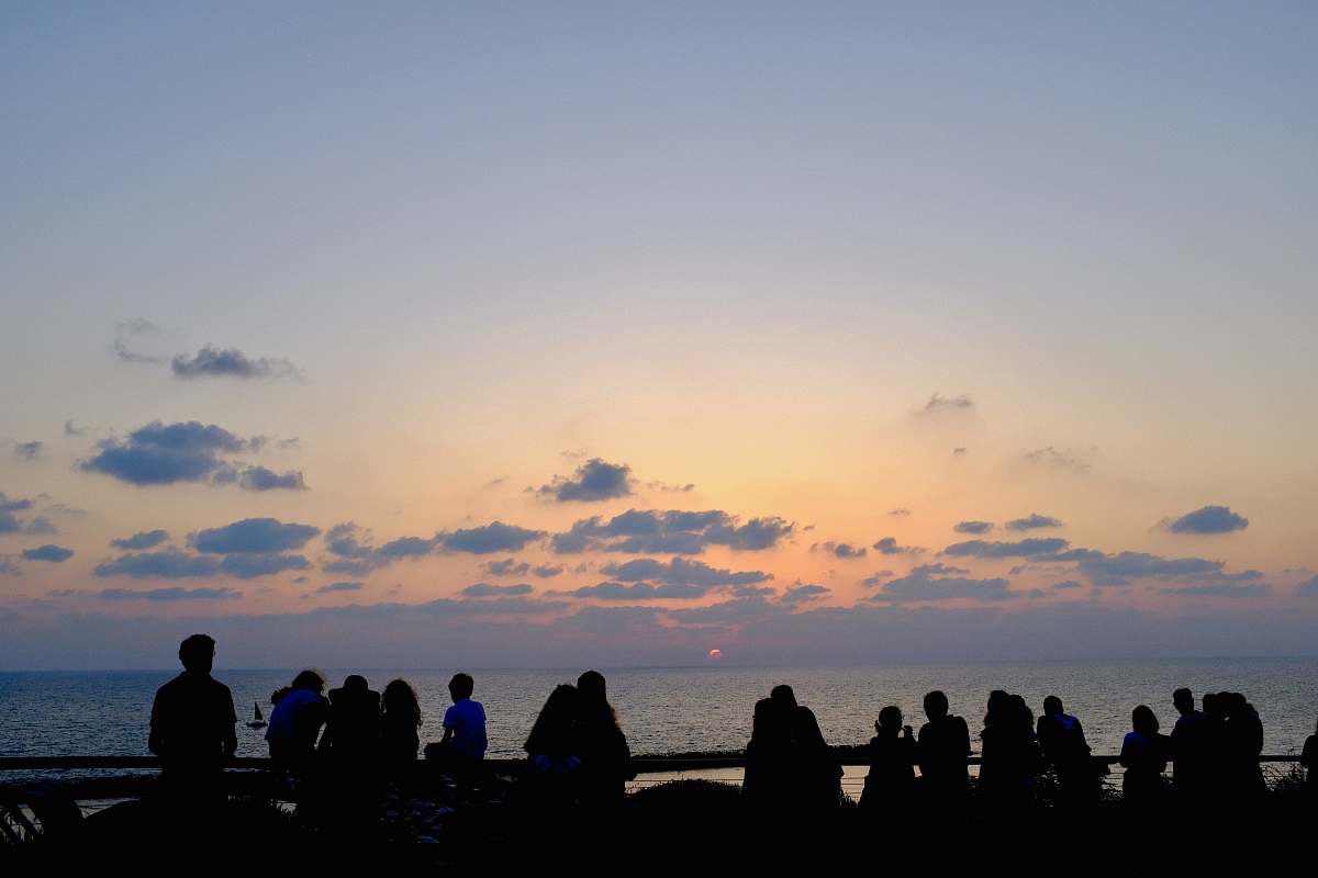 nature silhouette of people facing ocean outdoors