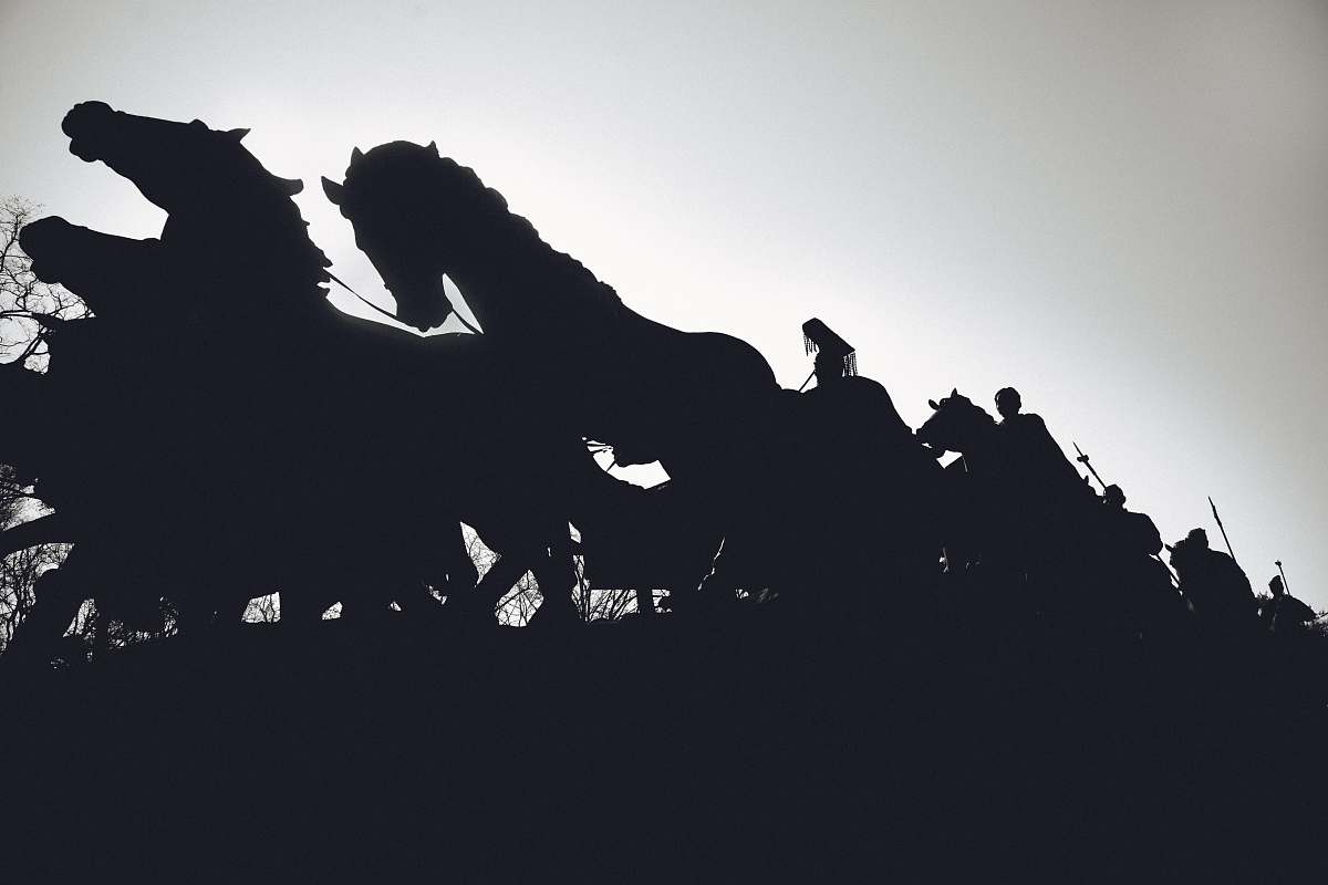 bird silhouette of people riding horses animal