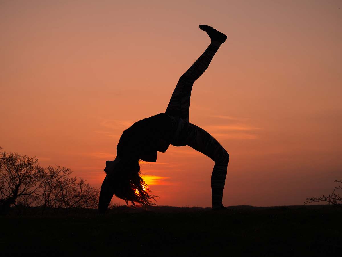 human silhouette of person doing bending person