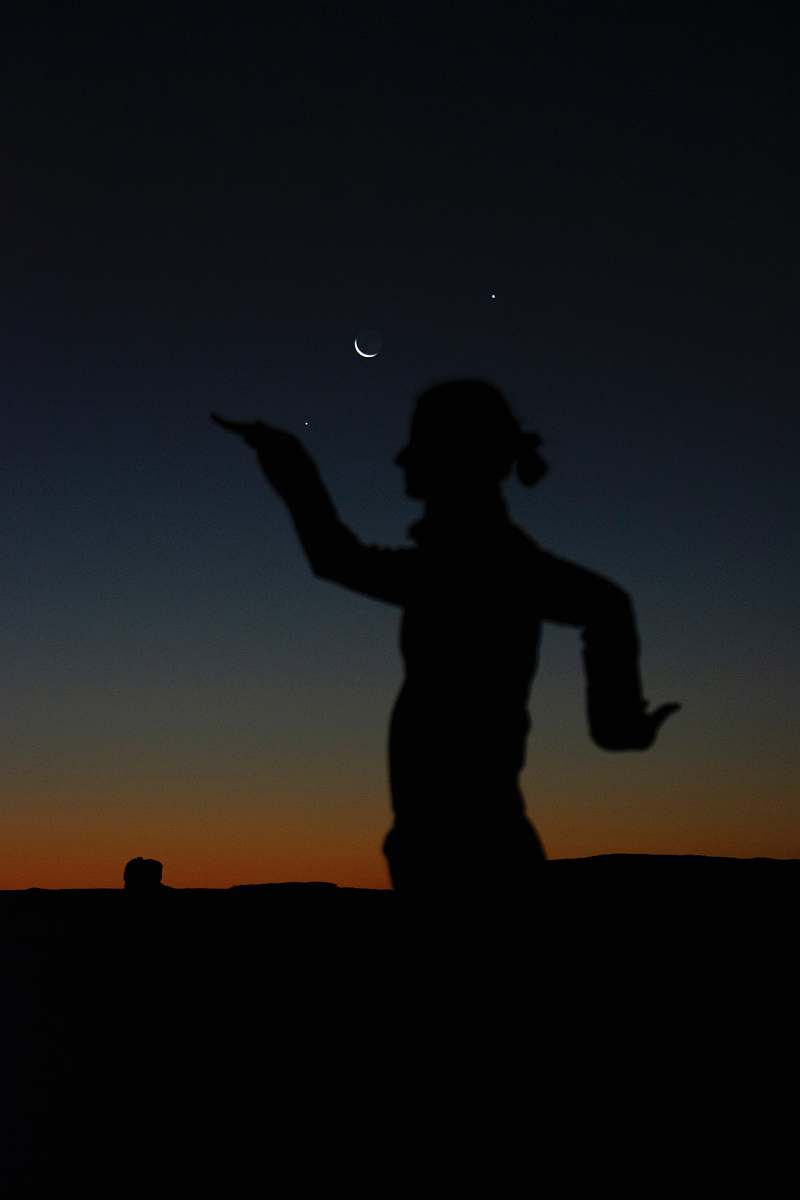 nature silhouette of person doing poses during golden hour outdoors