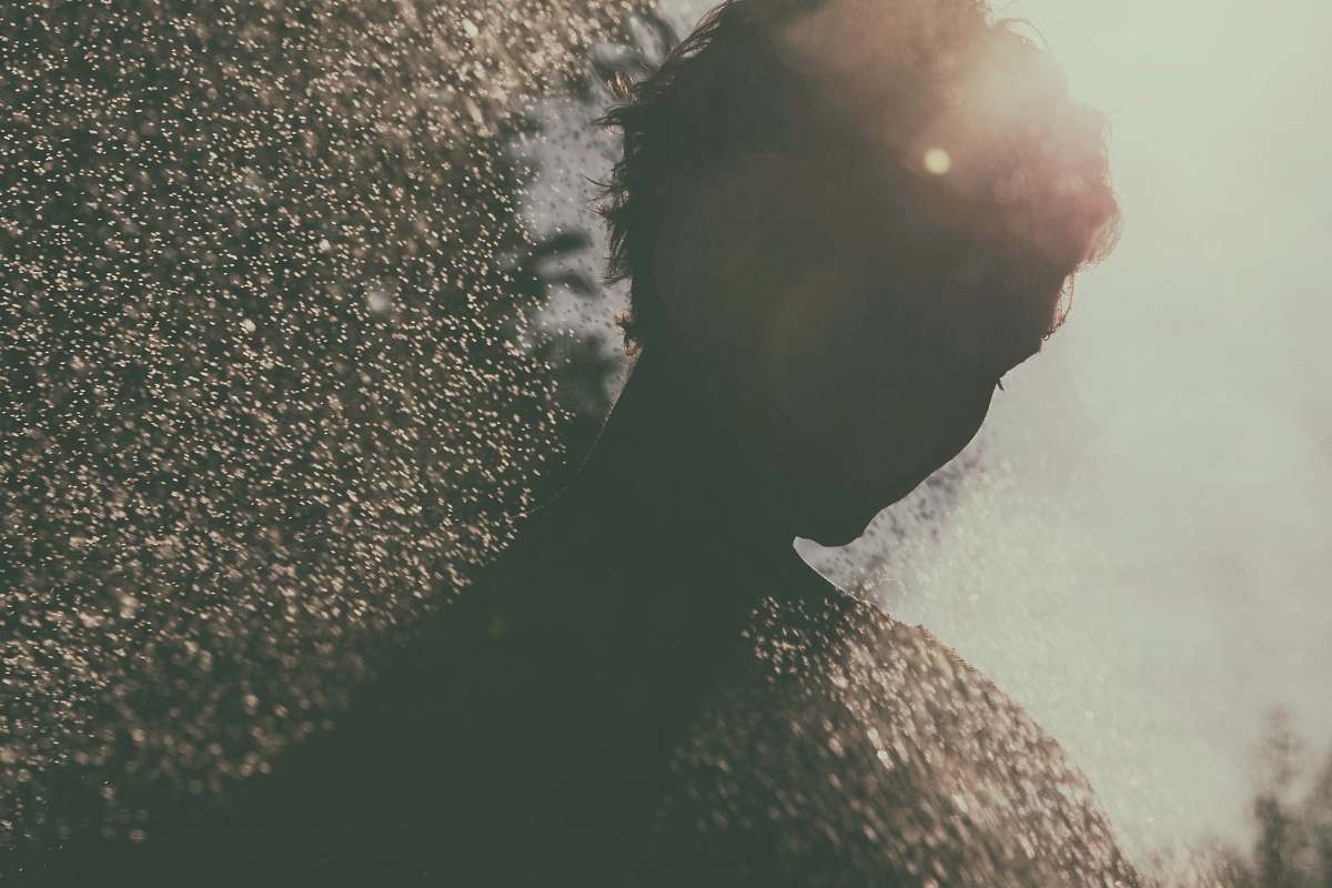 grey silhouette of person rain