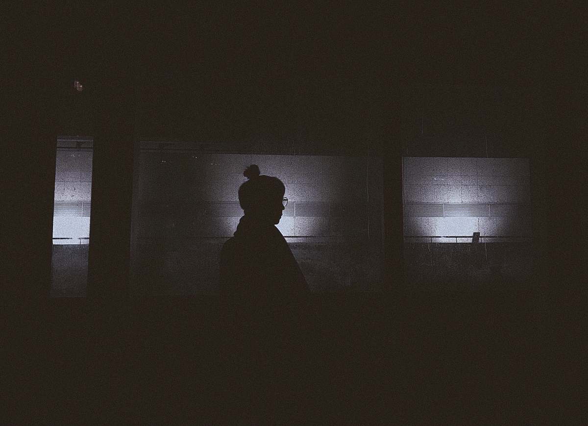 grey silhouette of person in room scary