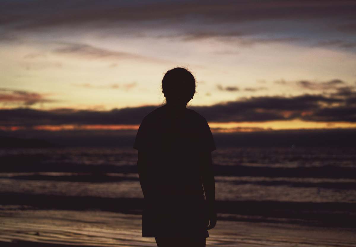 person silhouette of person near ocean human