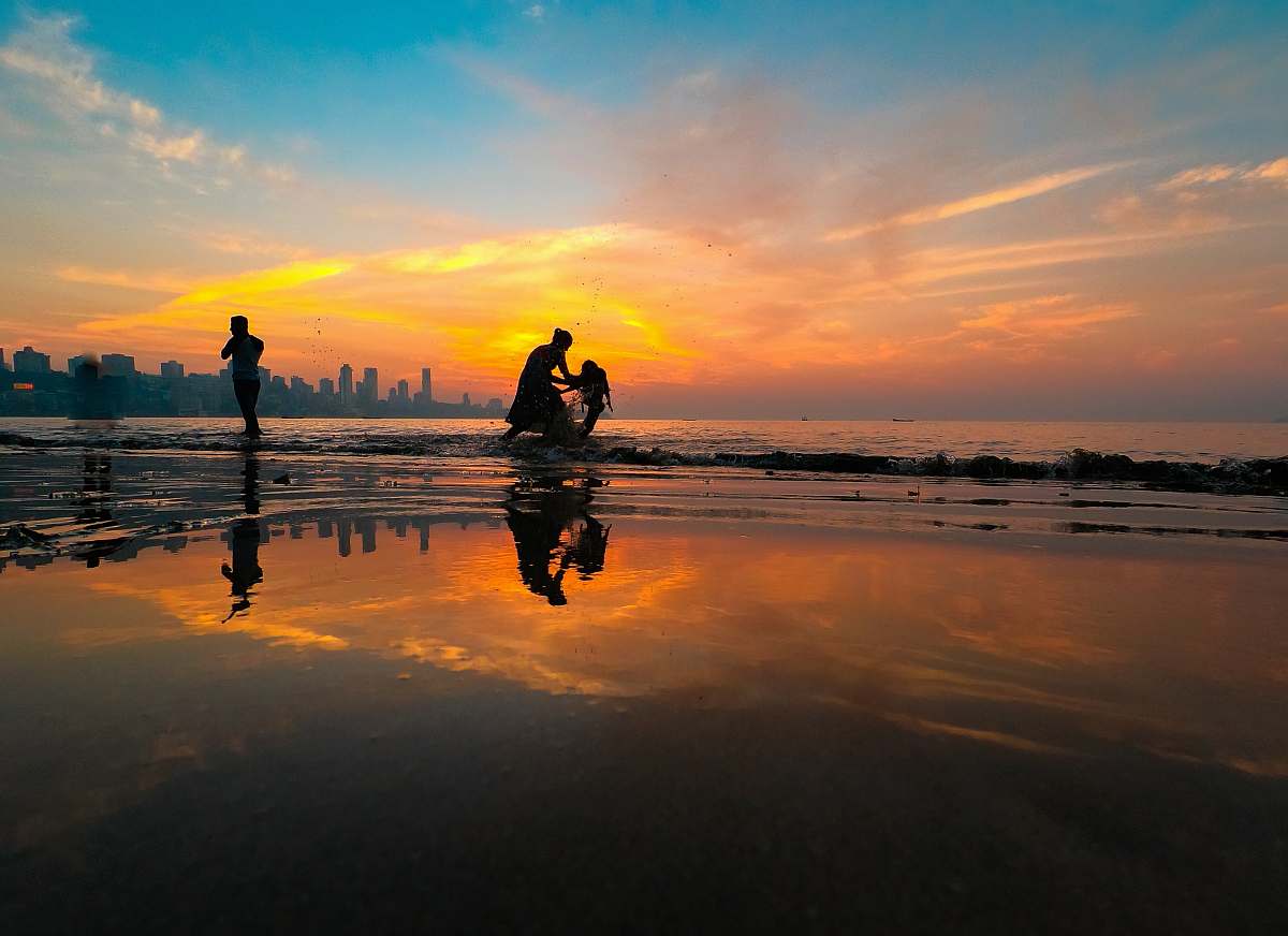human silhouette of person on seashore person